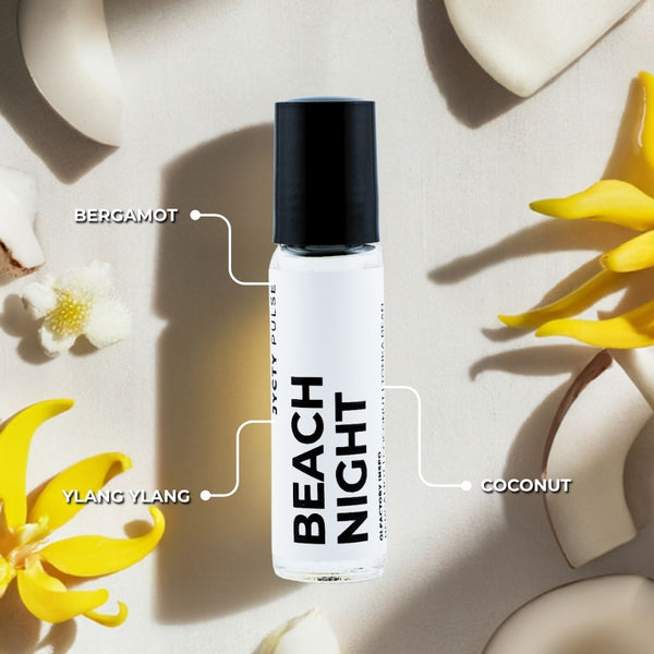 Perfume bottle labeled 'Beach Night' with floral elements on a light background