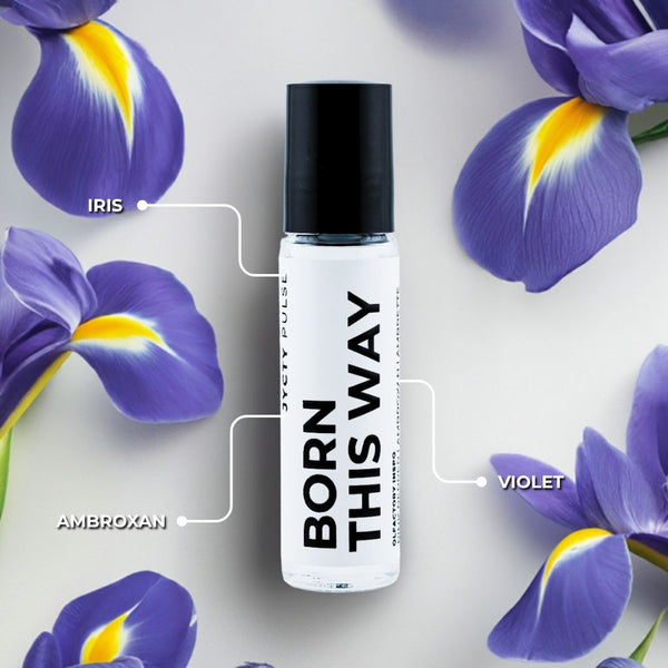 Roll-on bottle labeled 'Born This Way' with purple flowers in the background
