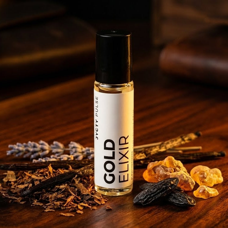 Bottle of Gold Elixir cologne oil on a wooden surface with dried herbs ...