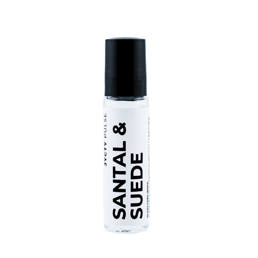 Roll-on bottle of Santal & Suede perfume with black cap on a white background
