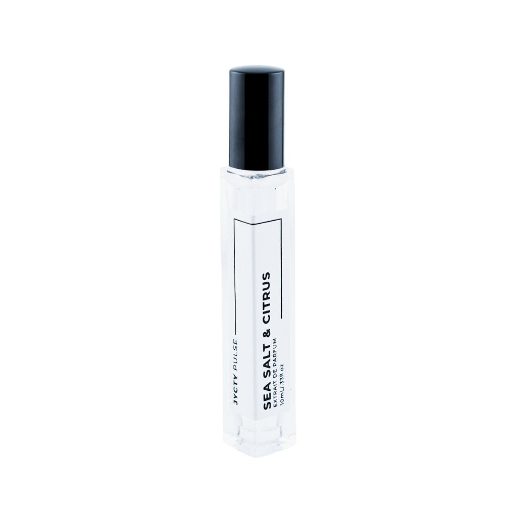Small clear bottle with black cap labeled 'Sea Salt & Citrus' on a white background