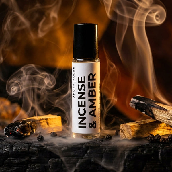Incense and Amber perfume oil bottle with smoke on a wooden surface